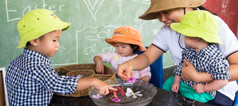 Carer looking after three young children